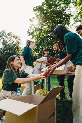 Volunteers helping people with food